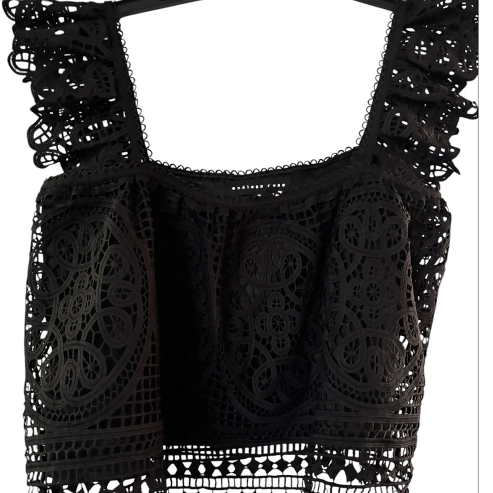 Black Sleeveless Crop Blouse with Ruffled Embellishments